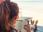 woman reading a book on the beach