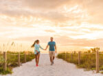 A couple walking on a Sanibel Island beach