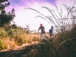 two people biking